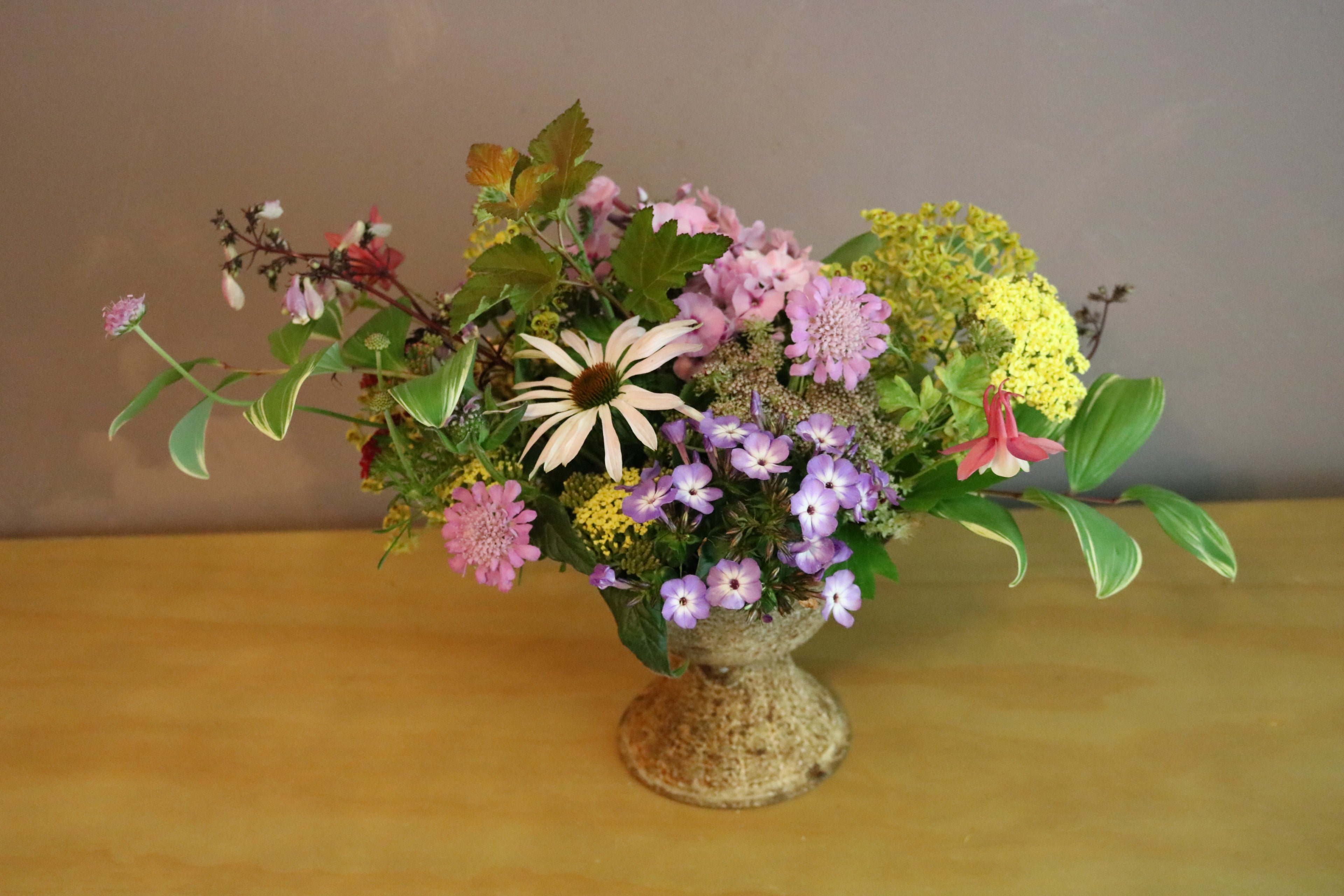 Designer Arrangement in Iron Pedestal Vessel