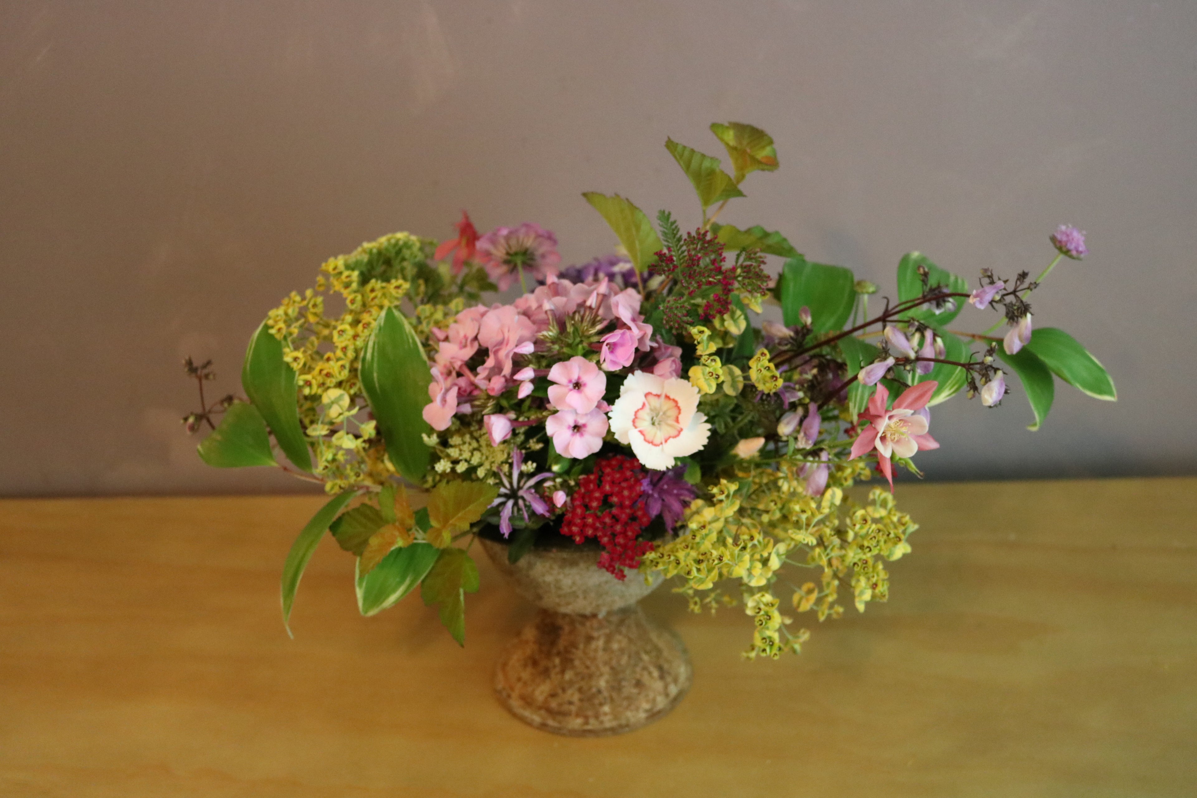 Designer Arrangement in Iron Pedestal Vessel